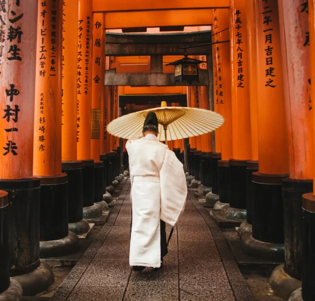 Walking through the famous torii gate path at Fushimi Inari, a centerpiece of Kyoto free walking tours