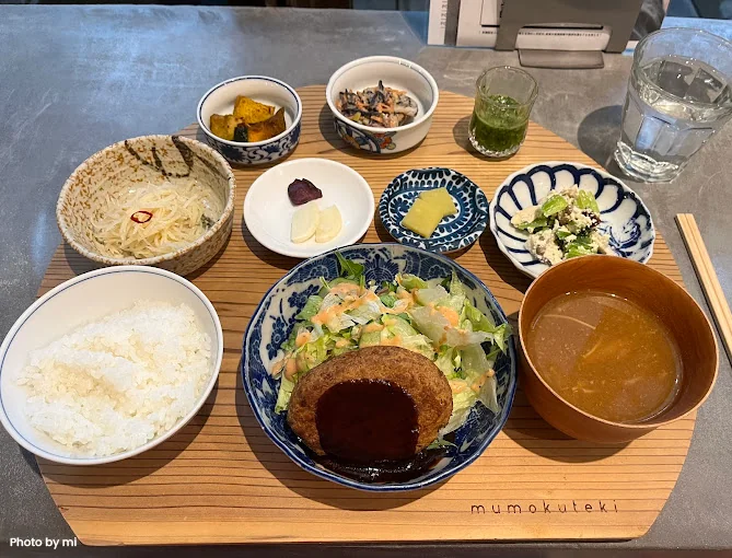 A classic vegan tempura set meal with dipping sauce, rice, and miso soup, a highlight of Kyoto’s plant-based cuisine