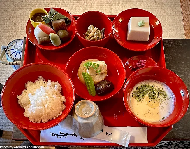 A colorful monk vegan Kyoto-style bento set featuring seasonal vegetables, tofu, and rice, perfect for a healthy meal